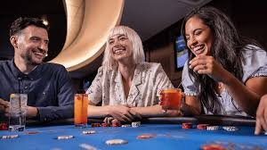 JILI live-dealer studio with multiple camera angles and professional croupiers at blackjack table